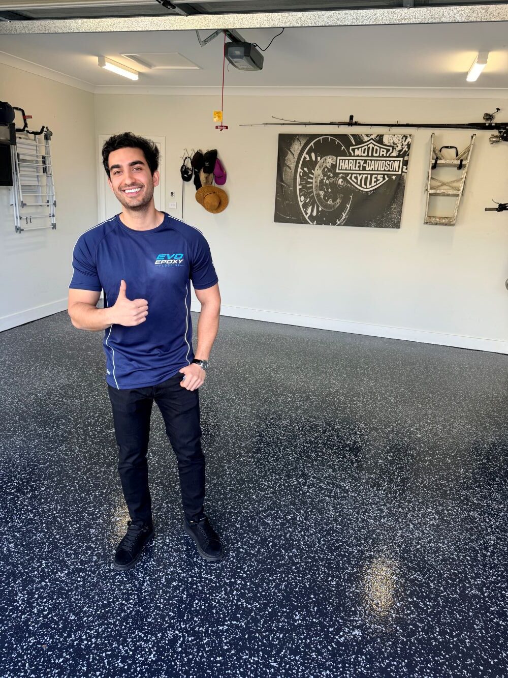 Kian from Evo Epoxy on a finished flake epoxy garage floor