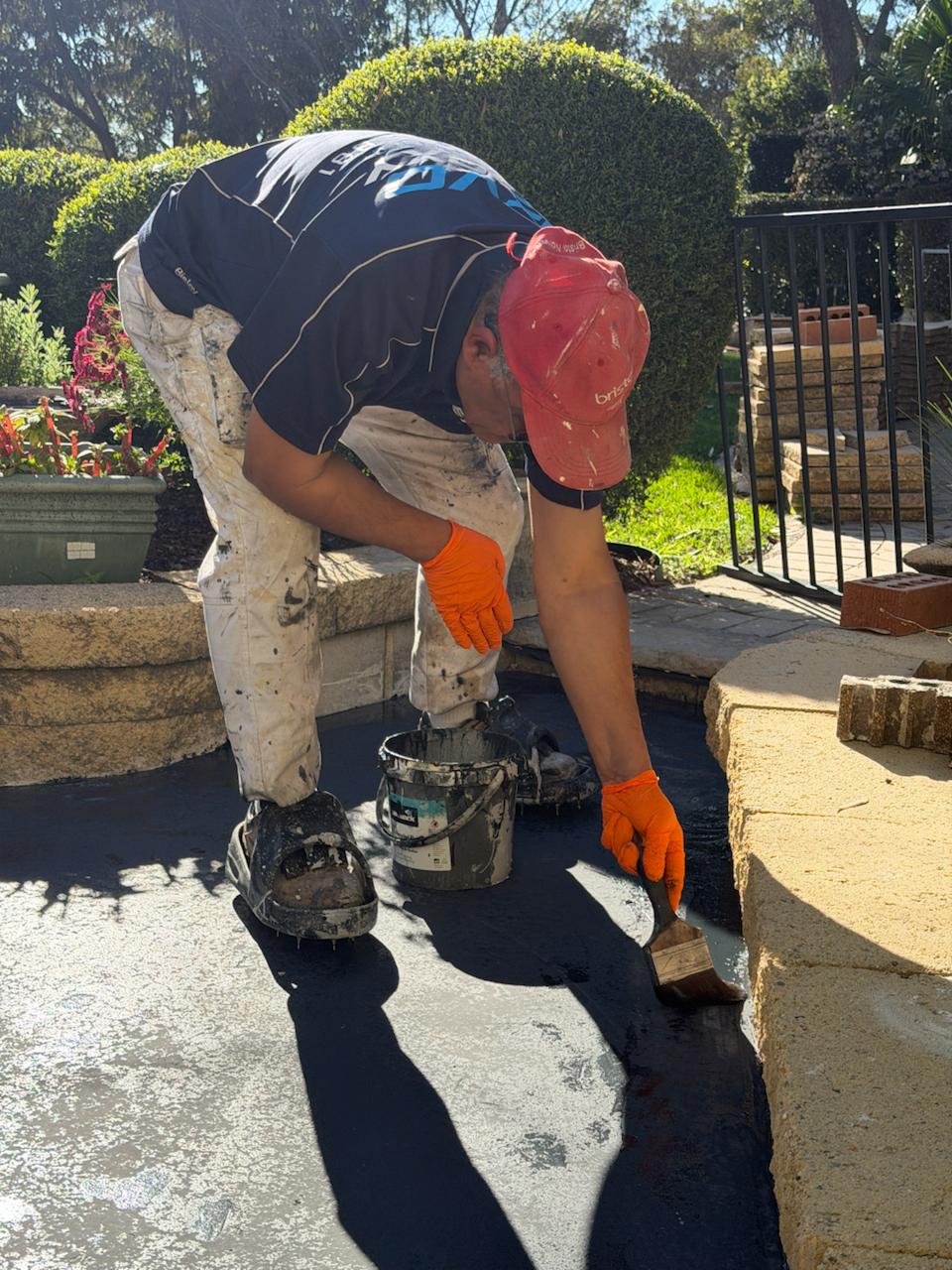 Evo Epoxy grinding the edge of a concrete driveway before sealing
