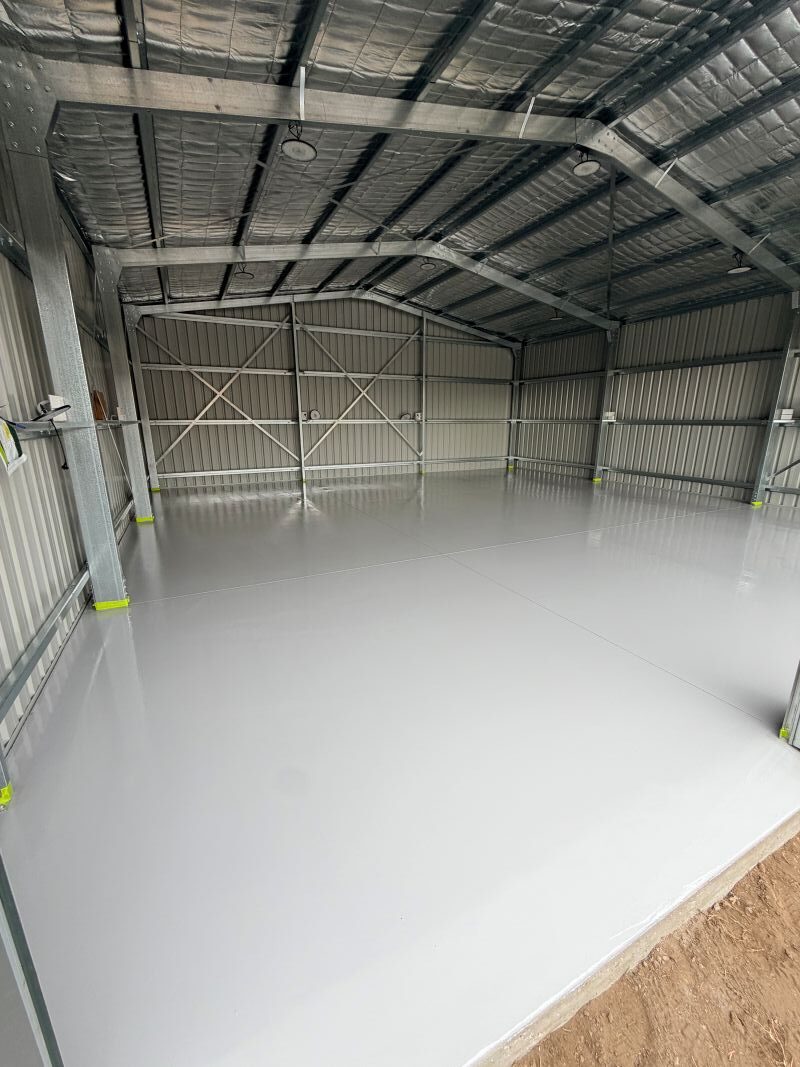 Shed floor after the light grey epoxy base coat